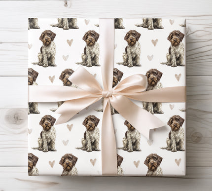 Beautiful Wirehaired Pointing Griffon wrapping paper showcasing detailed watercolor Griffon portraits paired with soft heart accents. Ideal for dog lovers, hunting dog owners, birthdays, holidays, and heartfelt gifts. Premium-quality wrapping paper with an elegant, timeless pet illustration style. Ships fast from the USA. 