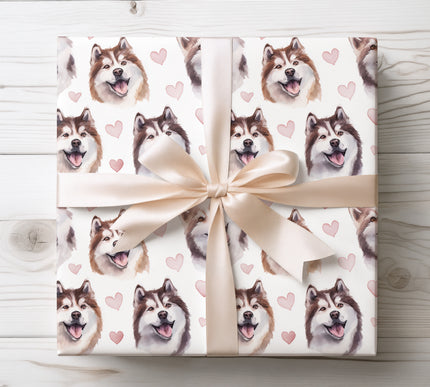 Premium Alaskan Malamute dog wrapping paper featuring expressive watercolor face portraits with soft blush hearts on a clean white background. Perfect gift wrap for Alaskan Malamute lovers, dog moms and dog dads, Valentine’s Day, birthdays, anniversaries, and heartfelt pet-themed gifts. High-quality wrapping paper with a warm, romantic charm. 