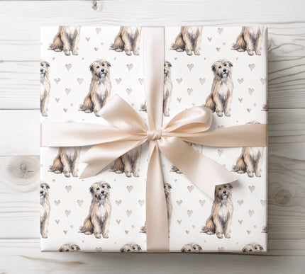 Soft watercolor Pyrenean Shepherd wrapping paper featuring a hand-painted dog illustration and subtle heart details on a clean white background. A charming, elegant gift wrap for dog lovers, pet parents, birthdays, holidays, and special occasions. High-quality print, seamless repeating design, perfect for wrapping meaningful gifts. Wrapping paper designed for a modern, pet-inspired aesthetic. 