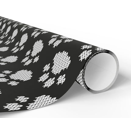 Celebrate your furry friends with Arctic Paws, a black and white knit paw print wrapping paper. This cozy, sweater-style design is perfect for dog lovers, pet-themed Christmas gifts, or winter birthdays. Available in matte or glossy finish, this festive wrap adds warmth and charm to every present. 